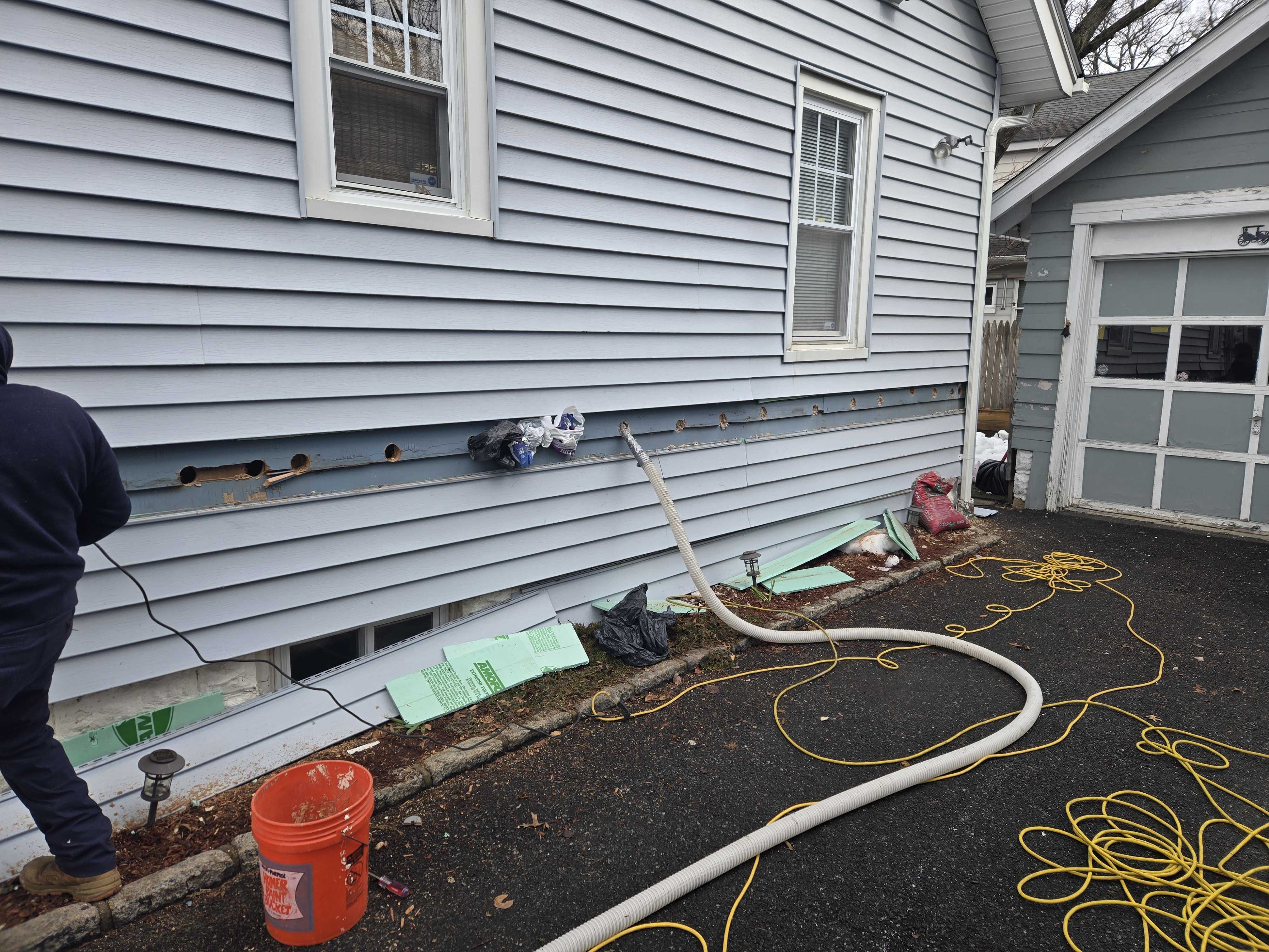 Maplewood resident Owen Tyrrell gets blown-in cellulose to insulate his home.